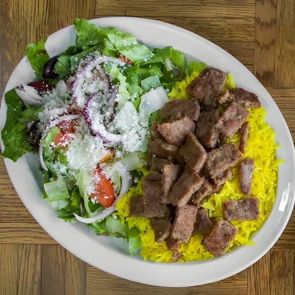 Shish Kebab House of Tucson's gyro plate with yellow rice, salad, and sliced meat.